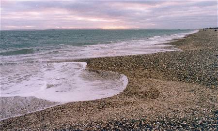 Natural cusps in the beach, being reshaped by the waves